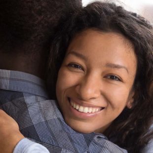 Woman embracing man