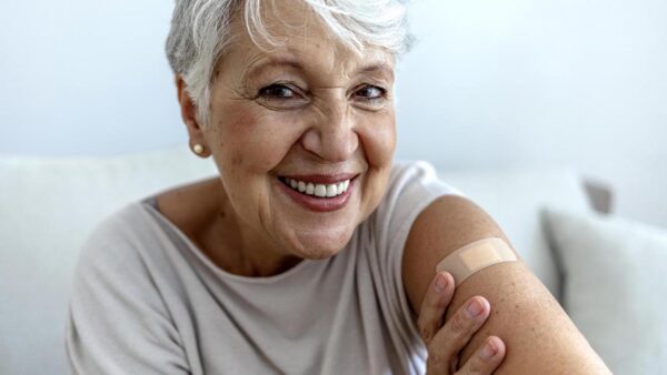 Happy woman after immunization