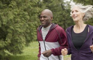 mature friends jogging in the park