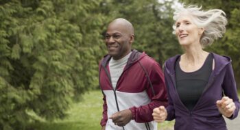 mature friends jogging in the park