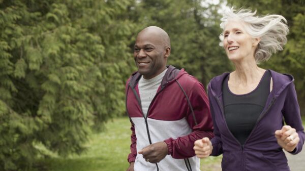 mature friends jogging in the park