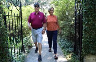 Kirk McMinn and his wife walking through Brookgreen Gardens.