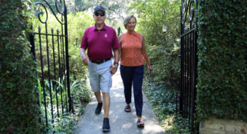 Kirk McMinn and his wife walking through Brookgreen Gardens.