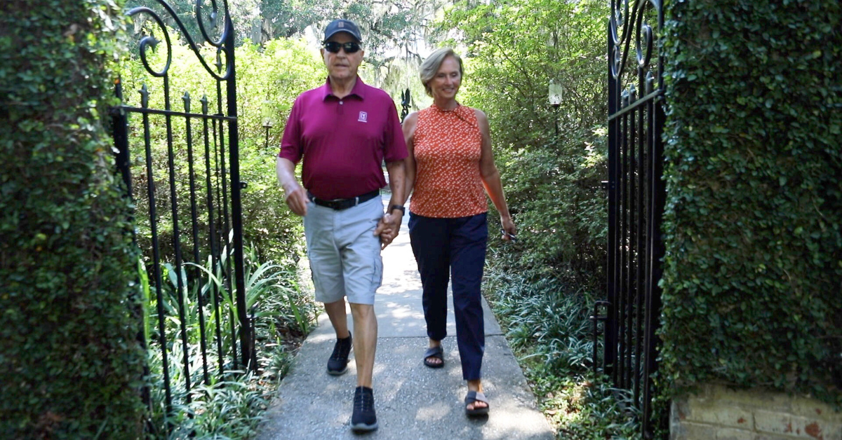 Kirk McMinn and his wife walking through Brookgreen Gardens.