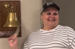 Survivor Sherry Bell rings the bell after she finishes her last radiation treatment.