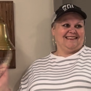 Survivor Sherry Bell rings the bell after she finishes her last radiation treatment.