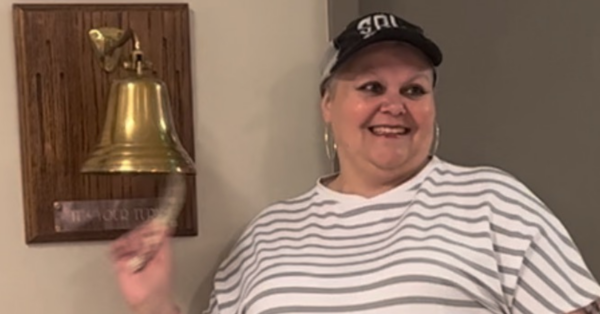 Survivor Sherry Bell rings the bell after she finishes her last radiation treatment.