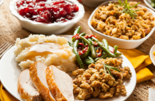 Homemade Turkey Thanksgiving Dinner with Mashed Potatoes, Stuffing, and green beans.