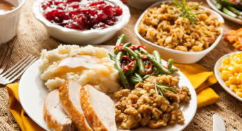 Homemade Turkey Thanksgiving Dinner with Mashed Potatoes, Stuffing, and green beans.