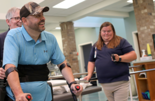 Matt Stewart beams with optimism as he learns to walk again using ReWalk exoskeleton.