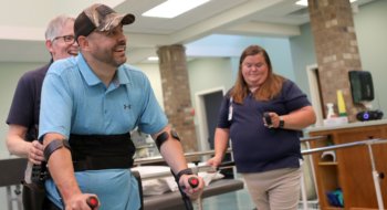 Matt Stewart beams with optimism as he learns to walk again using ReWalk exoskeleton.