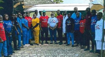 Dr. Ijem stands with a group of patients he cared for during his visit to Nigeria.